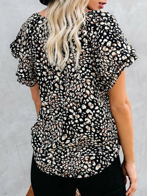 Black leopard print blouse with flutter sleeves and V-neck detail.
