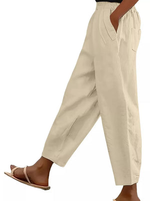 Apricot wide-leg maternity pants with pockets and a relaxed fit.
