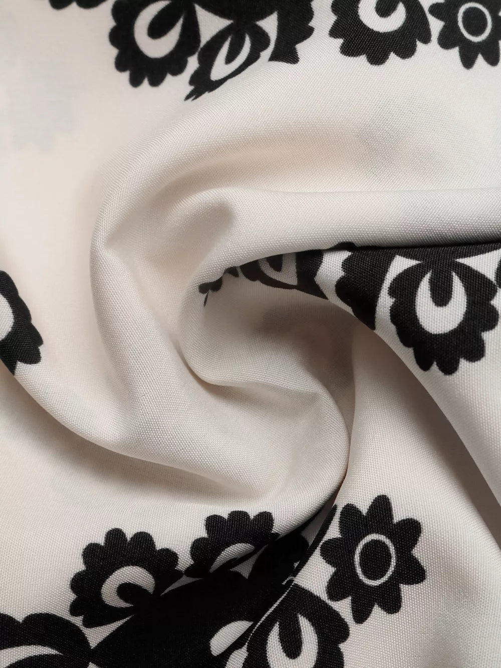 Loungewear shorts in ivory with a black medallion print and smocked waist detail.