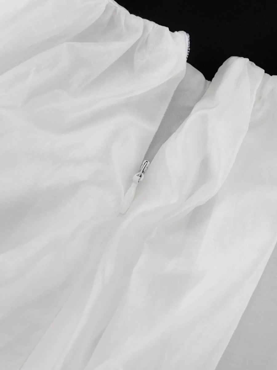 White sheer fabric dress with a zipper detail
