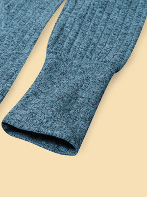 Blue textured knit long-sleeve top with ribbed cuffs and hem detail.