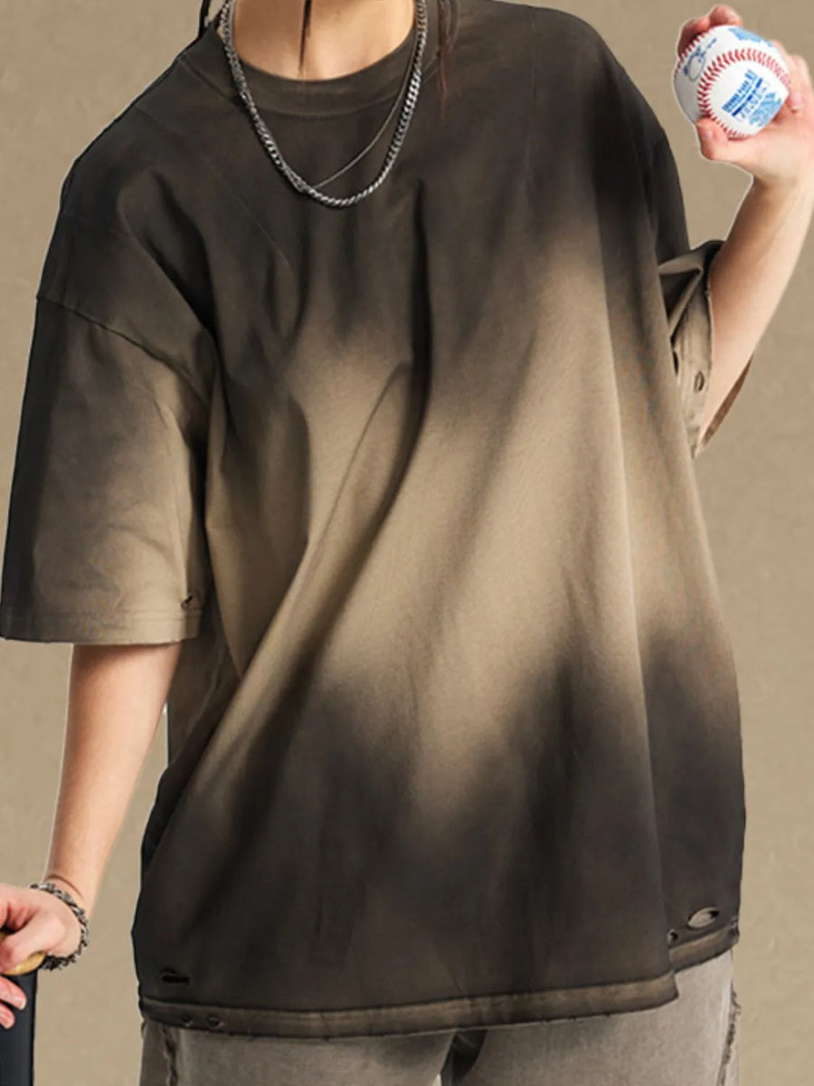 Oversized tee with faded dark gray to khaki ombre, distressed details, and short sleeves.