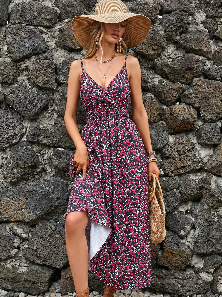 Midi dress with floral print, v-neck, spaghetti straps, smocked bodice, and asymmetrical hem.