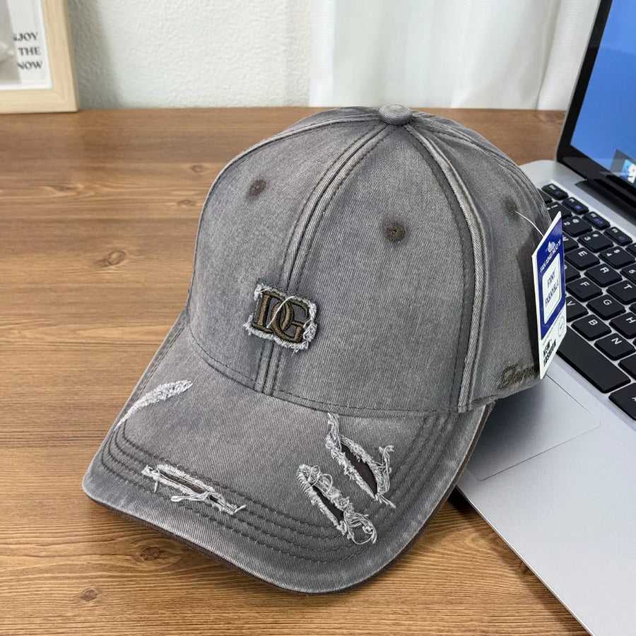 Gray distressed baseball cap with DG logo patch and ripped details