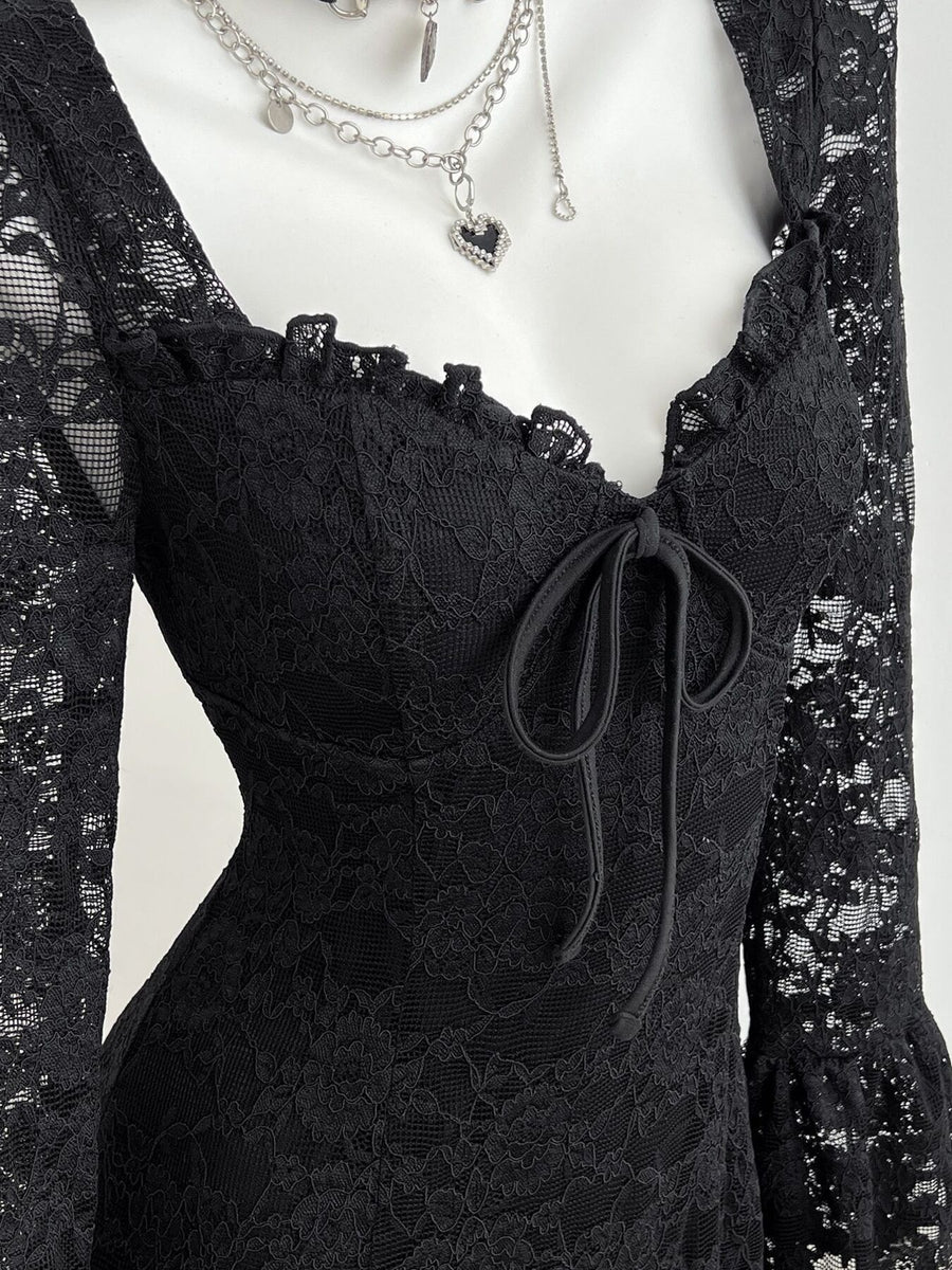 Black mini dress featuring lace and floral