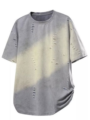Oversized distressed grey t-shirt with tie-dye effect and raw hem.
