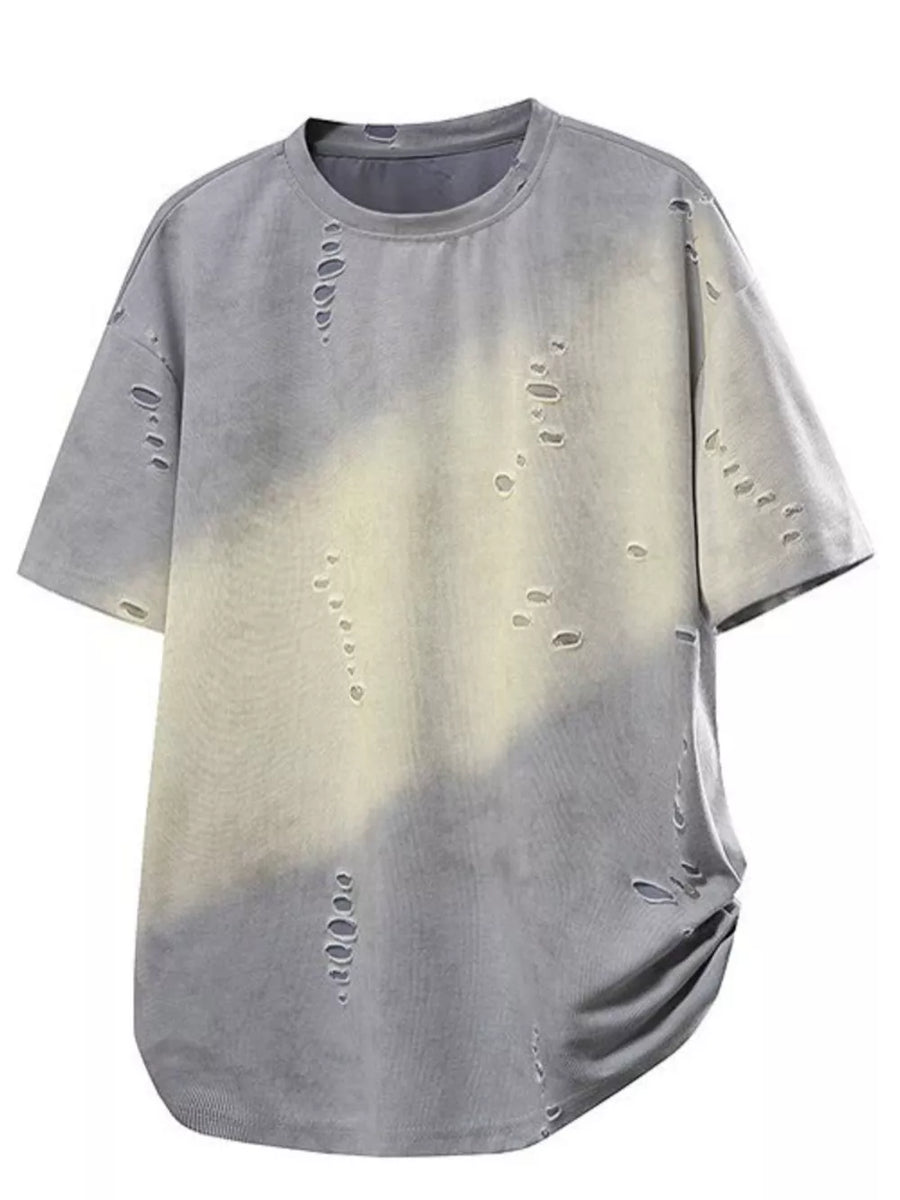 Oversized distressed grey t-shirt with tie-dye effect and raw hem.