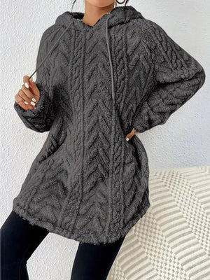 Textured gray fleece hoodie with drawstring and chevron pattern.