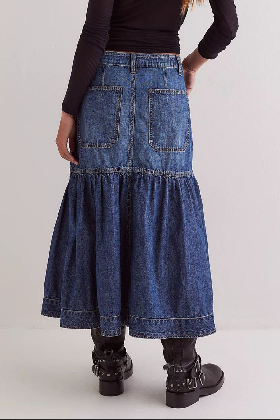 Denim midi skirt in dark wash with flounce hem and patch pockets.