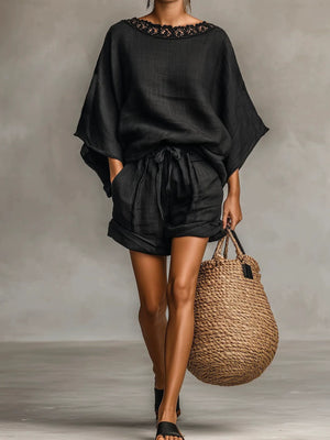 pajama set in black featuring lace trim and oversized fit
