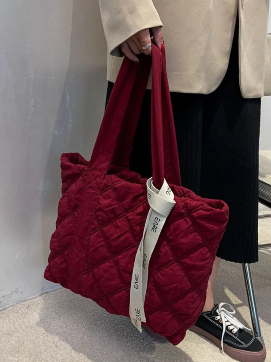 Burgundy diamond quilt nylon tote bag with logo strap detail