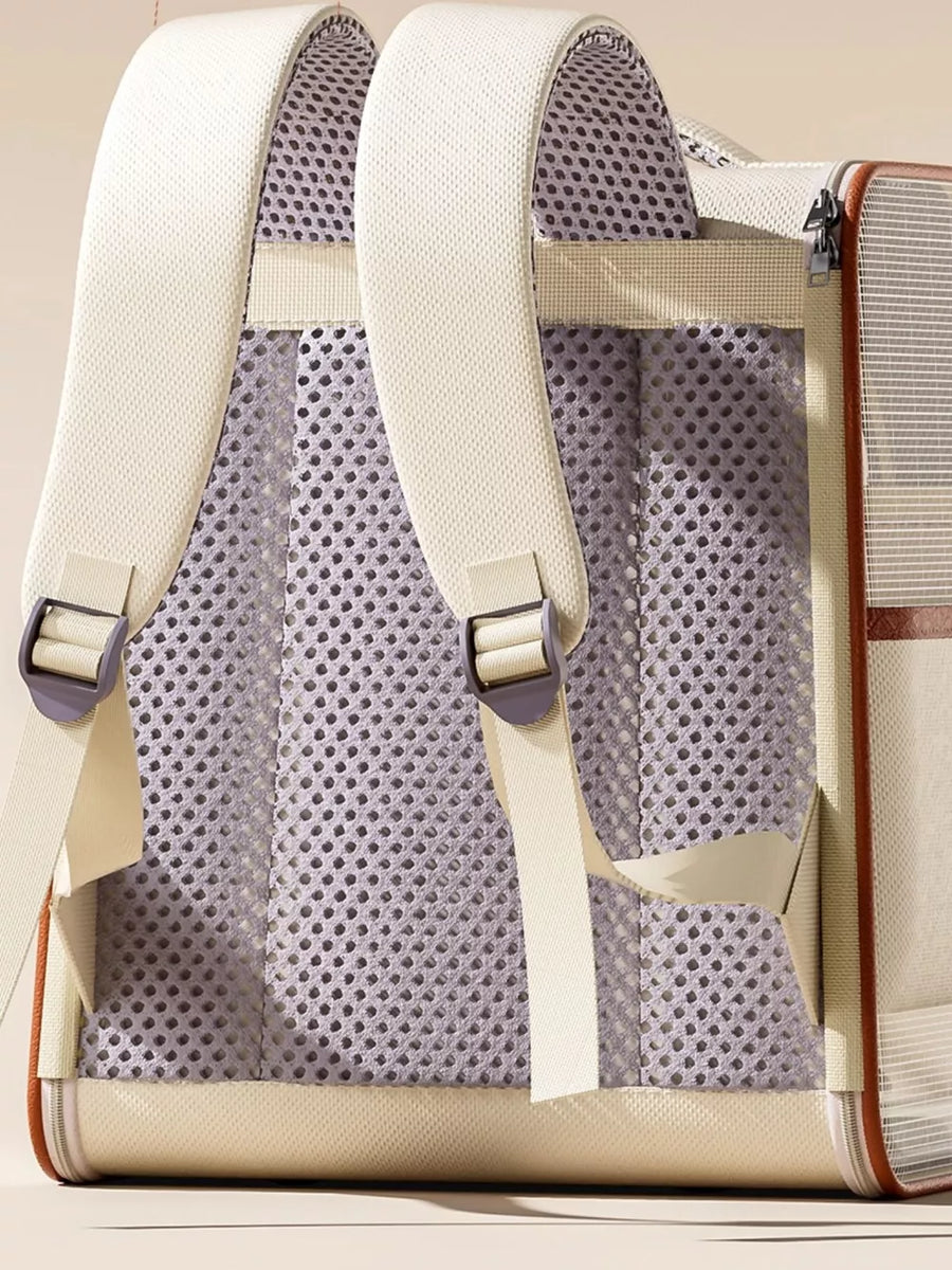 Chic two-tone pet carrier backpack with padded straps and breathable mesh back.