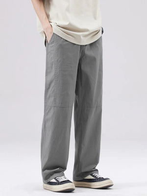 Men's grey casual wide-leg sweatpants with visible stitching details.