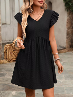 Black a-line dress with ruffled sleeves and v-neck, above knee length.