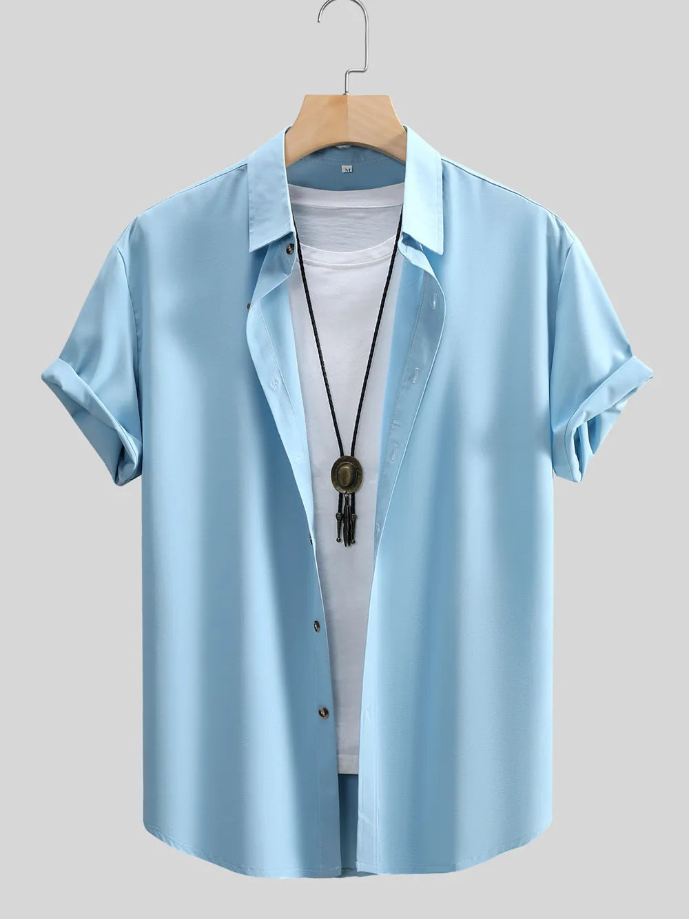 button-up shirt in sky blue featuring buttoned and regular fit