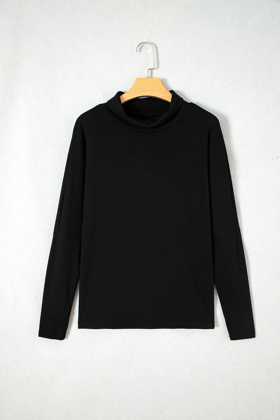 black top with curved hem and long sleeve