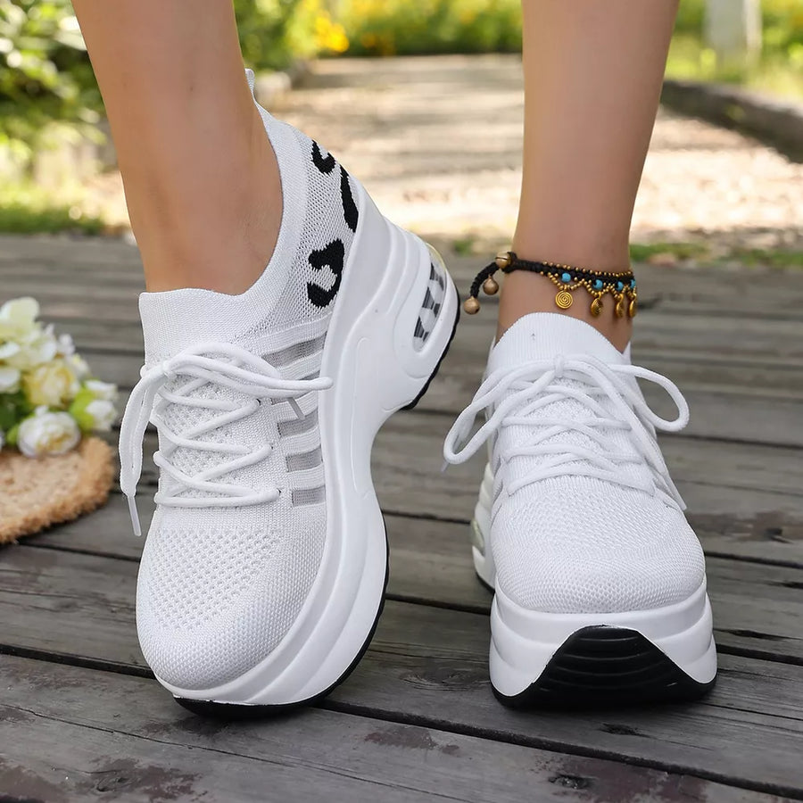 Black sneakers with platform sole and not applicable