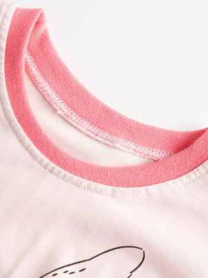 White t-shirt with pink trim neckline and a graphic detail.