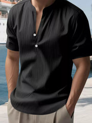 Black relaxed-fit band collar shirt with button detail and short sleeves.