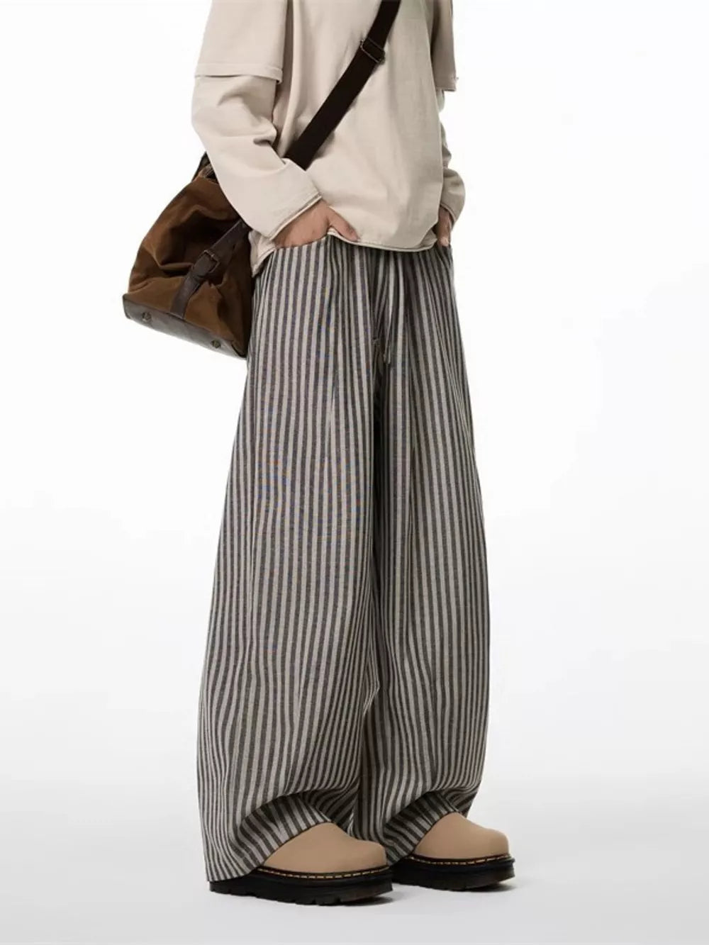 Striped wide-leg sweatpants in gray with a drawstring waist and relaxed fit.