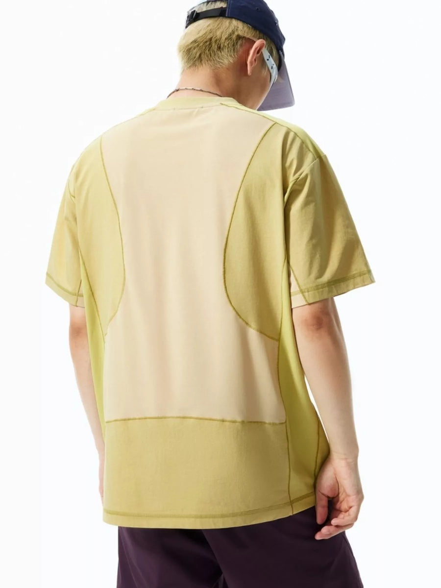 Relaxed fit t-shirt in light green with contrast stitching and paneling detail.