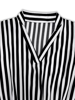 Notched long-sleeve midi dress in black and white stripe with V-neckline.