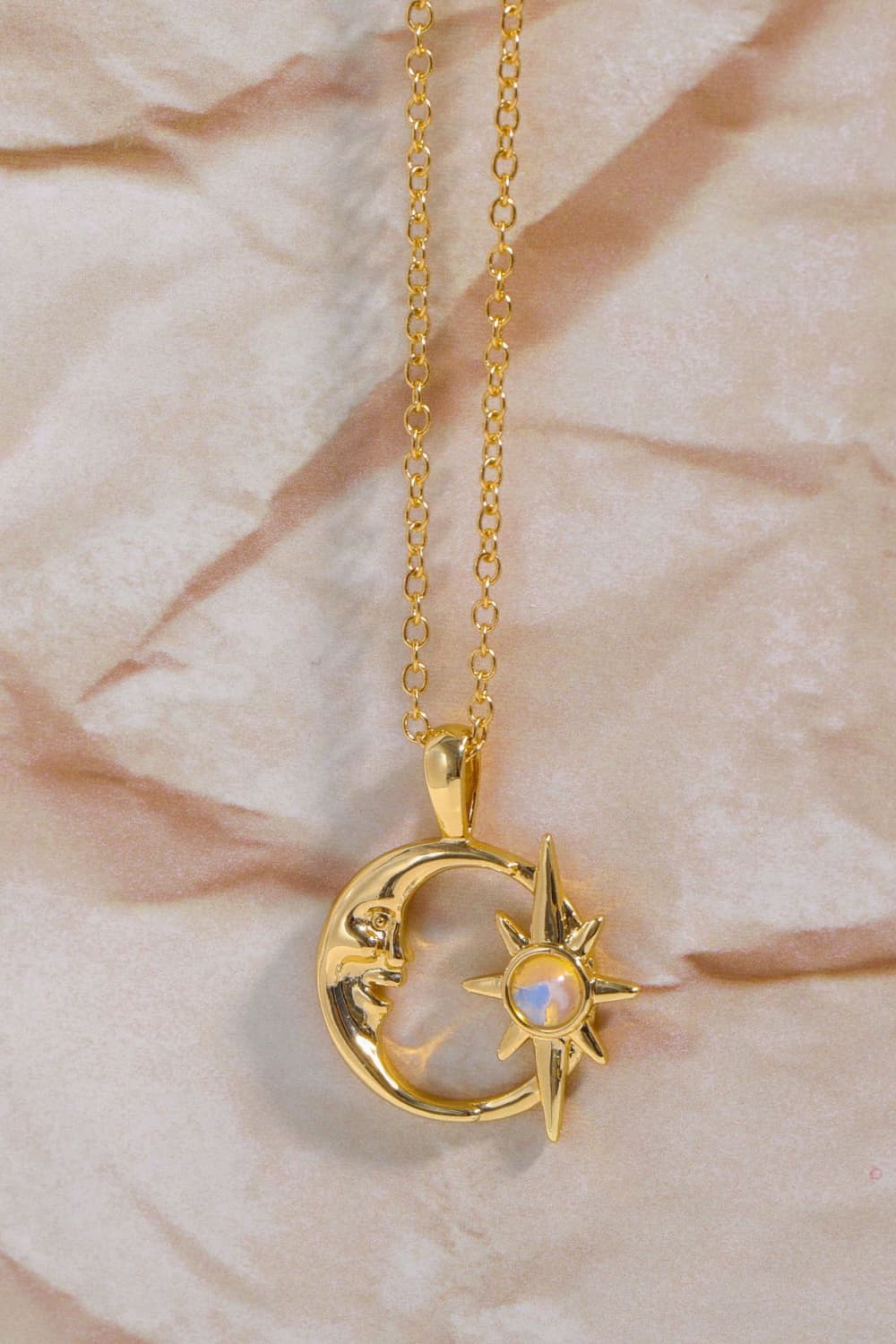 Gold celestial crescent moon and starburst necklace with opal detail