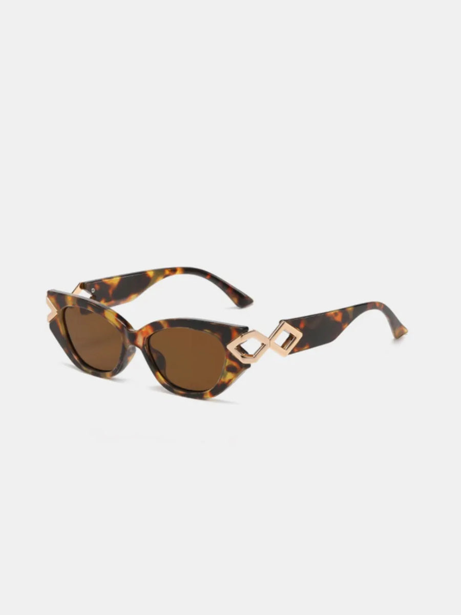 Geometric accent cat-eye sunglasses in tortoise shell with gold details and brown lenses.