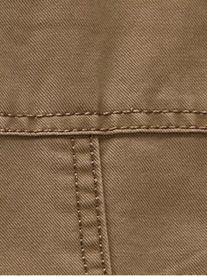 Khaki cotton blazer detail showing stitching and fabric texture.