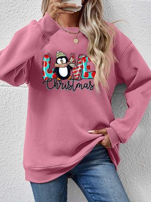 Blush Pink sweatshirt with festive penguin graphic and Christmas text.