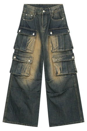 Faded wash dark blue denim cargo jeans with multiple button flap pockets and baggy fit.