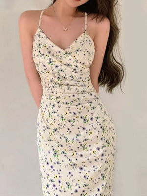 Floral ruched midi dress with spaghetti straps in beige with a delicate floral print.