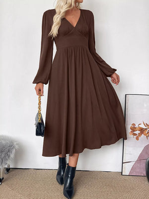 Brown V-neck midi dress with puff sleeves and A-line skirt.