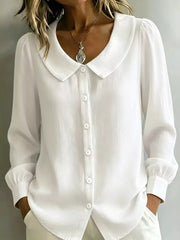 button-down shirt in white featuring buttoned and relaxed fit