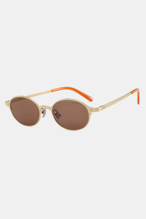 Gold oval sunglasses with brown lenses and orange temple tips