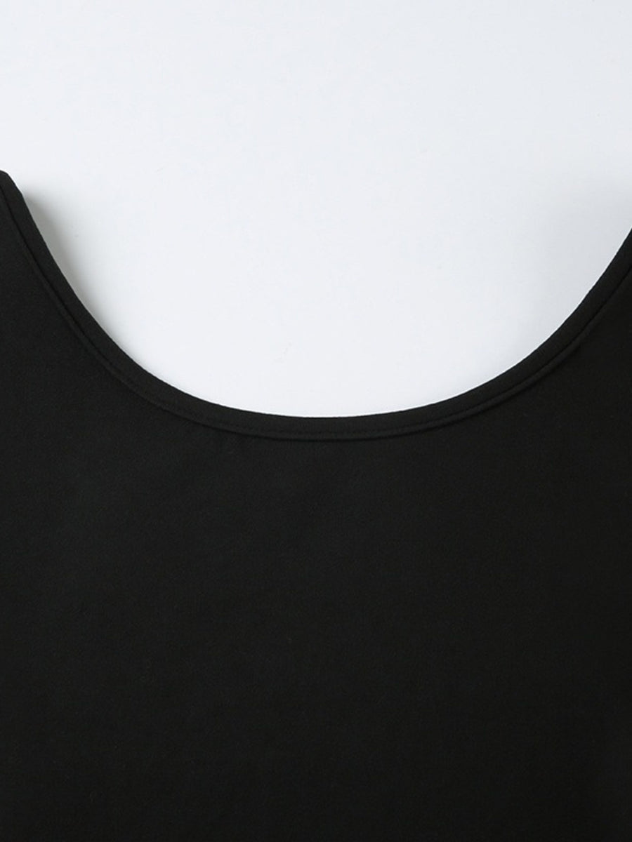 Black long-sleeve active romper with a boat neck and body-contouring fit.