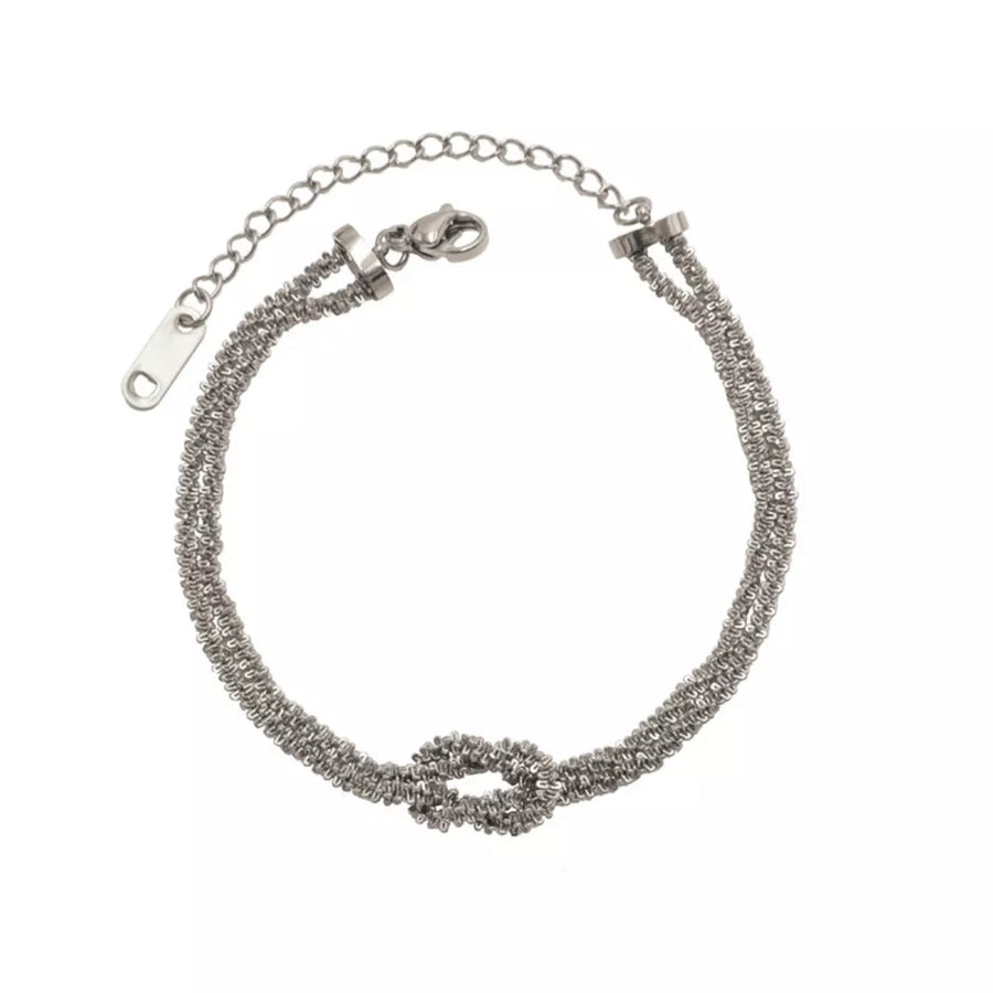 bracelet featuring twisted in silver with 18K Gold-Plated,Stainless Steel,Silver-plated Care instructions: Avoid wearing d