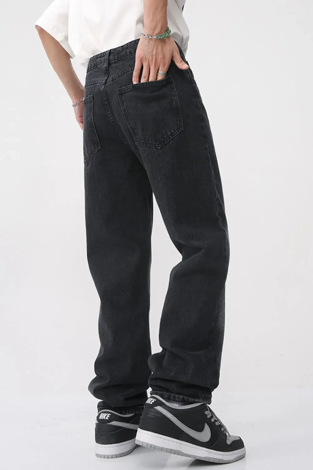 Faded wash baggy jeans in dark denim with a relaxed fit.