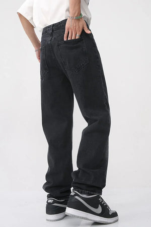 Faded wash baggy jeans in dark denim with a relaxed fit.