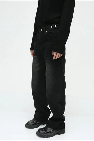 Relaxed fit denim jeans in dark vintage wash with button fly.