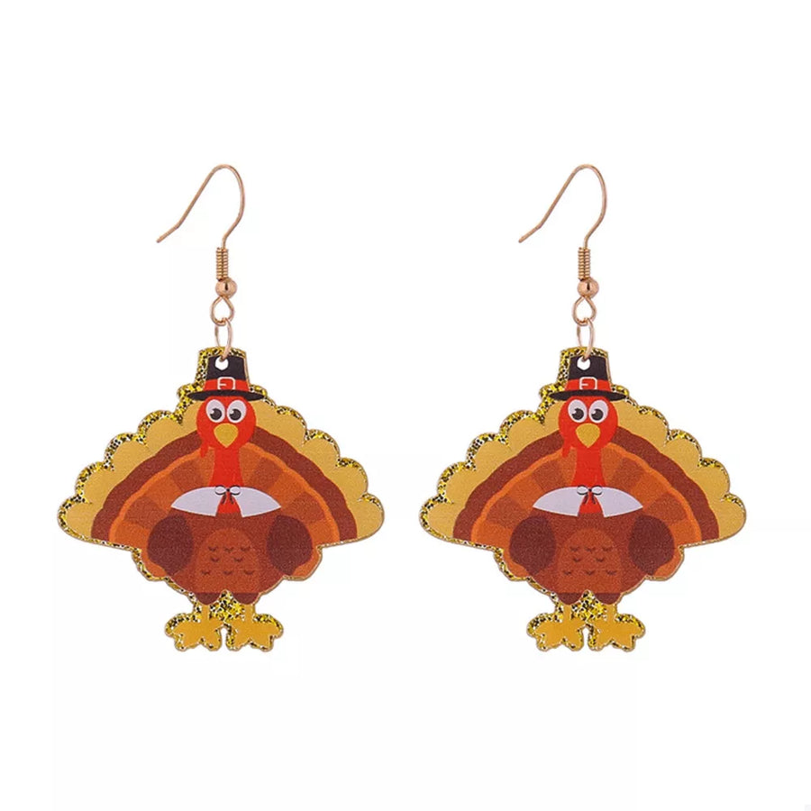 Festive turkey dangle earrings with pilgrim hats and glitter accents.