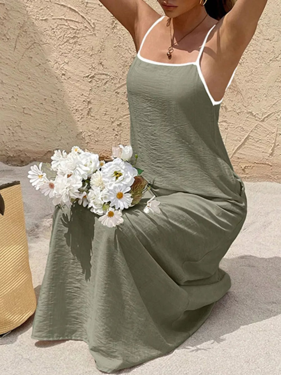Olive spaghetti strap maxi dress with white contrasting trim and a-line cut.