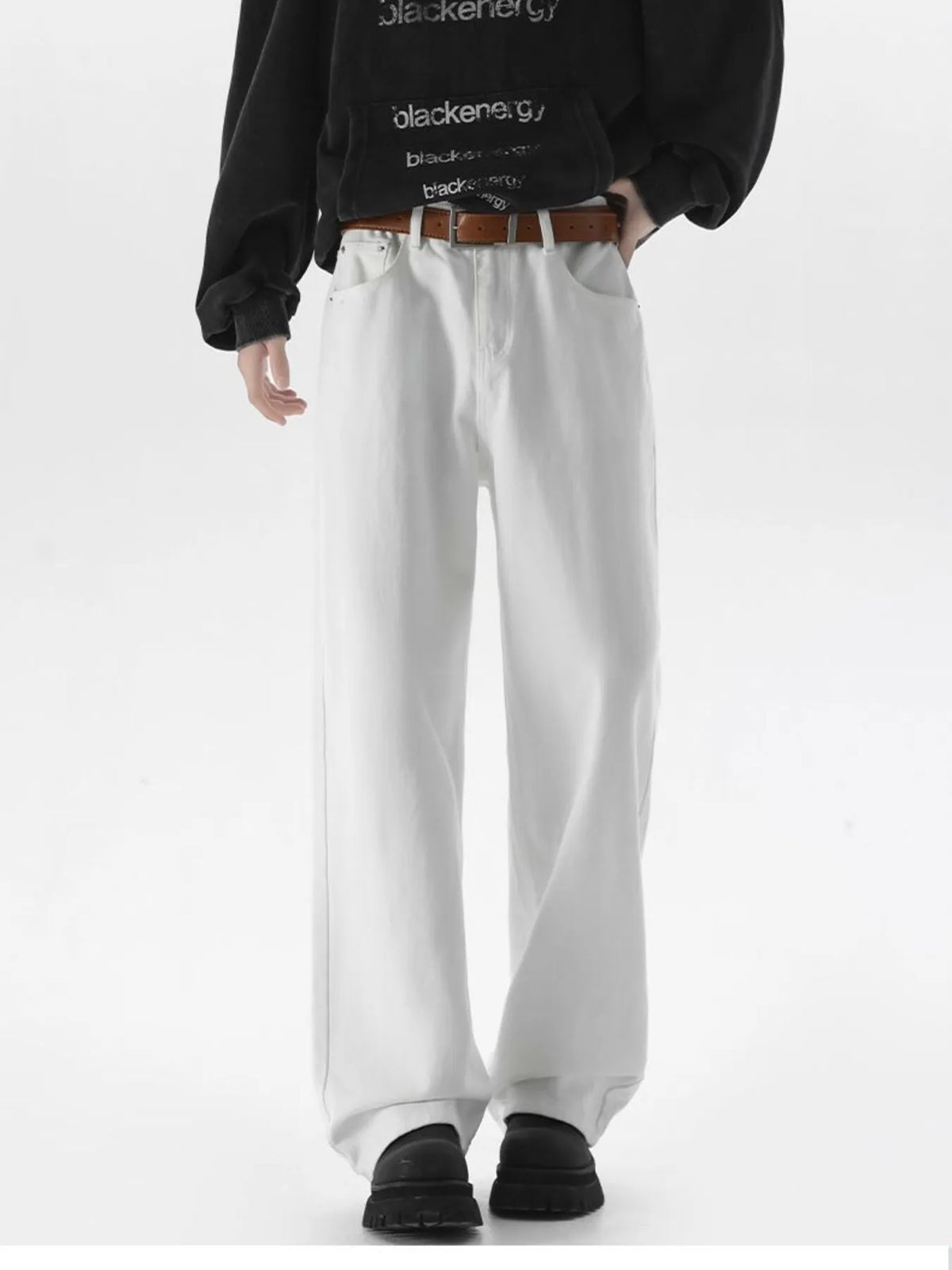 White wide-leg comfort fit jeans with a brown belt, styled casually.