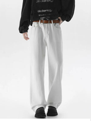 White wide-leg comfort fit jeans with a brown belt, styled casually.