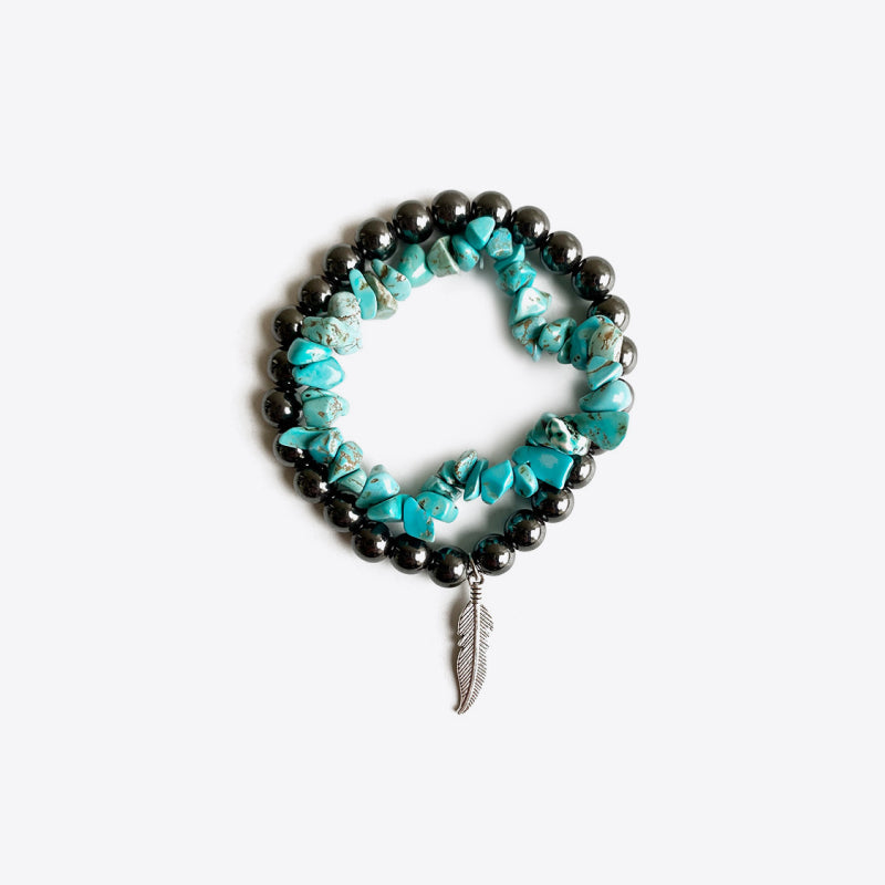 Hematite and turquoise stacked bracelet with feather charm