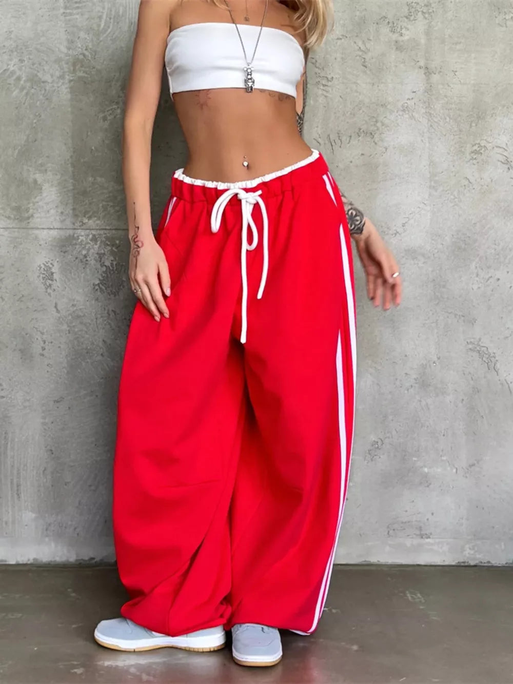 sweatpants in red featuring drawstring and wide-leg fit