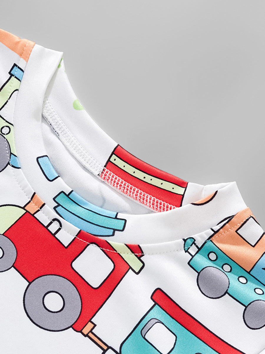 Toddler t-shirt with a playful all-over train print in red, blue, and orange on white.
