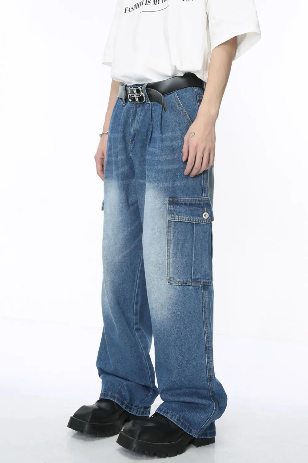 Pleated wide-leg denim cargo pants in medium wash with cargo pockets and a relaxed fit.