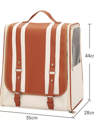 Chic two-tone brown and cream striped pet carrier backpack with leather accents and buckles.