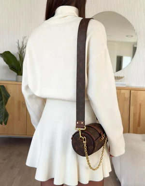 White turtleneck sweater and flared skirt set, casual autumn fashion for women.
